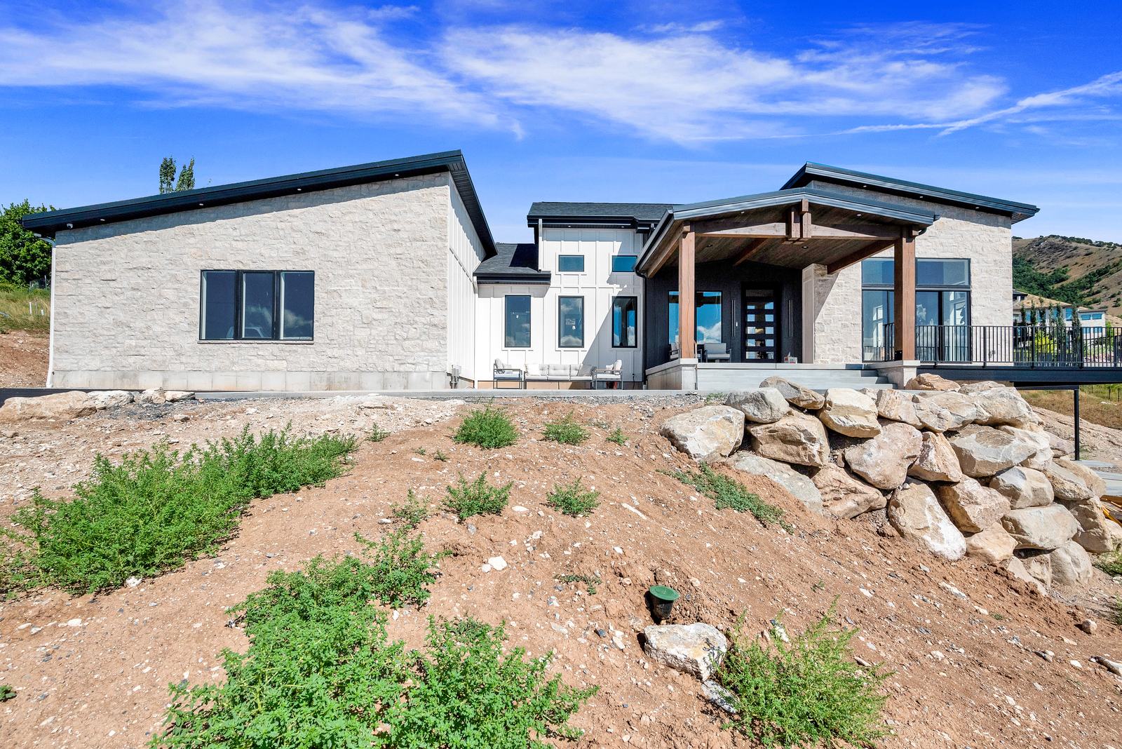 Valley View Estate front exterior with a covered entry porch, 2023 Top of Utah Parade of Homes